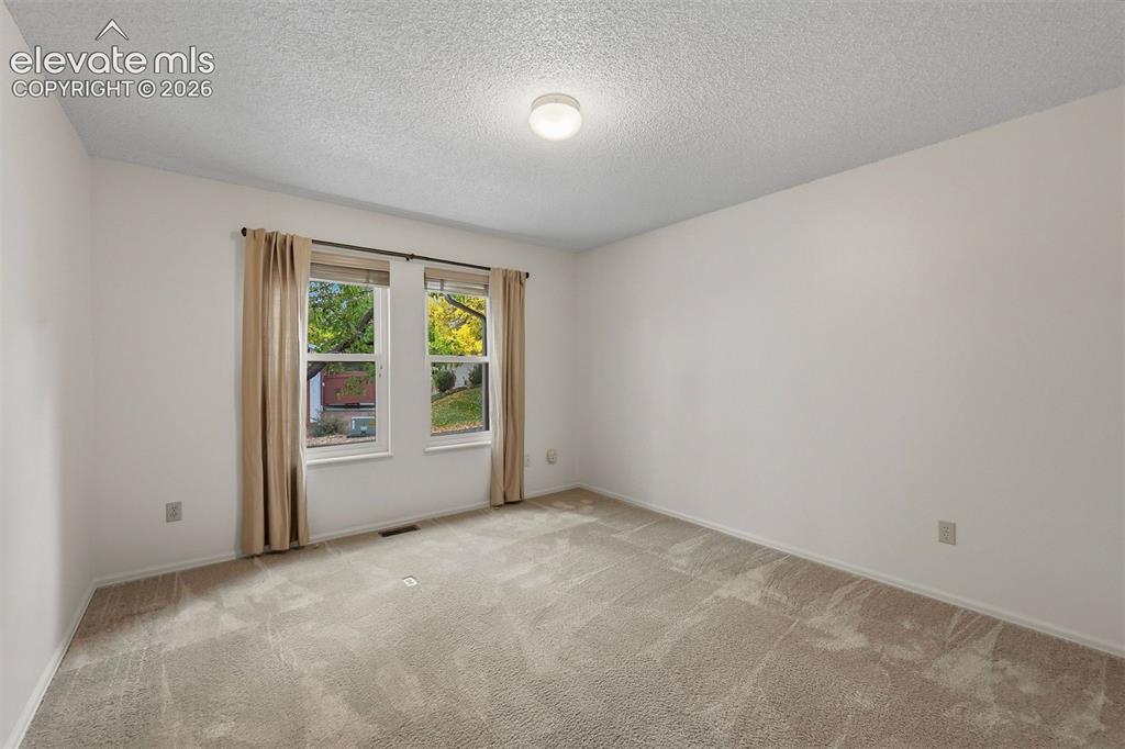 Image 21 of 40: Fourth bedroom on front of home. 