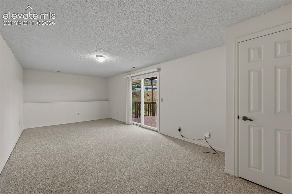 Image 25 of 40: Basement walkout family room