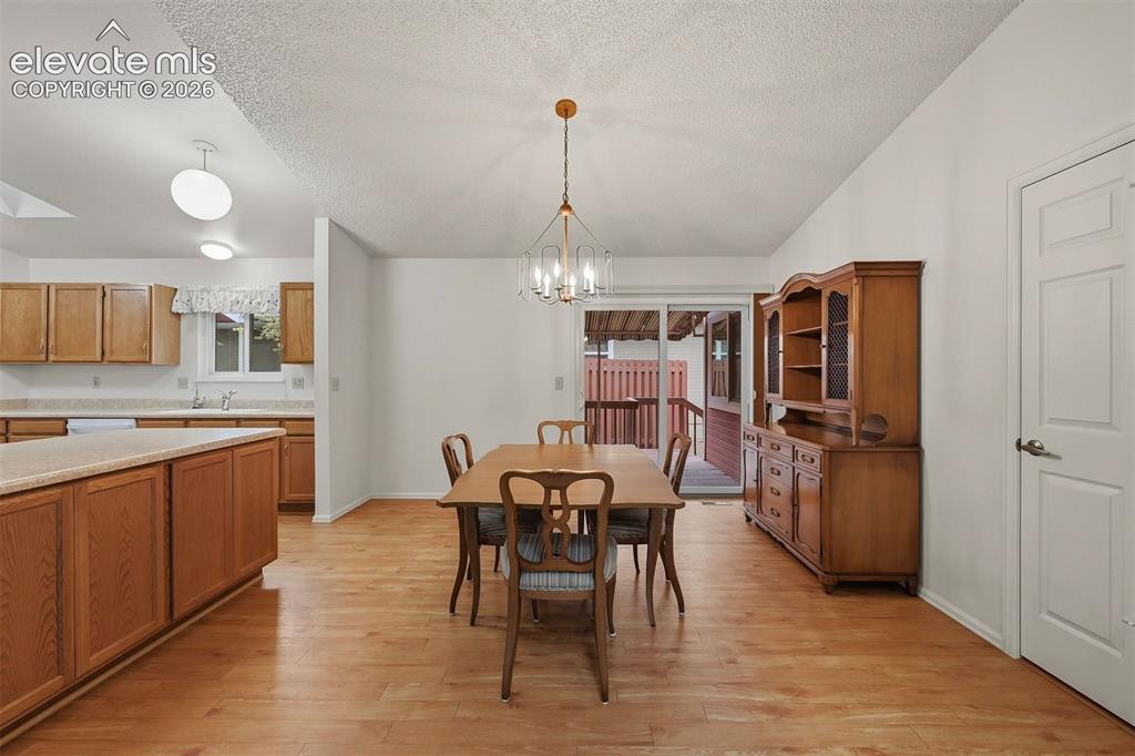 Image 4 of 40: Dining area and walkout
