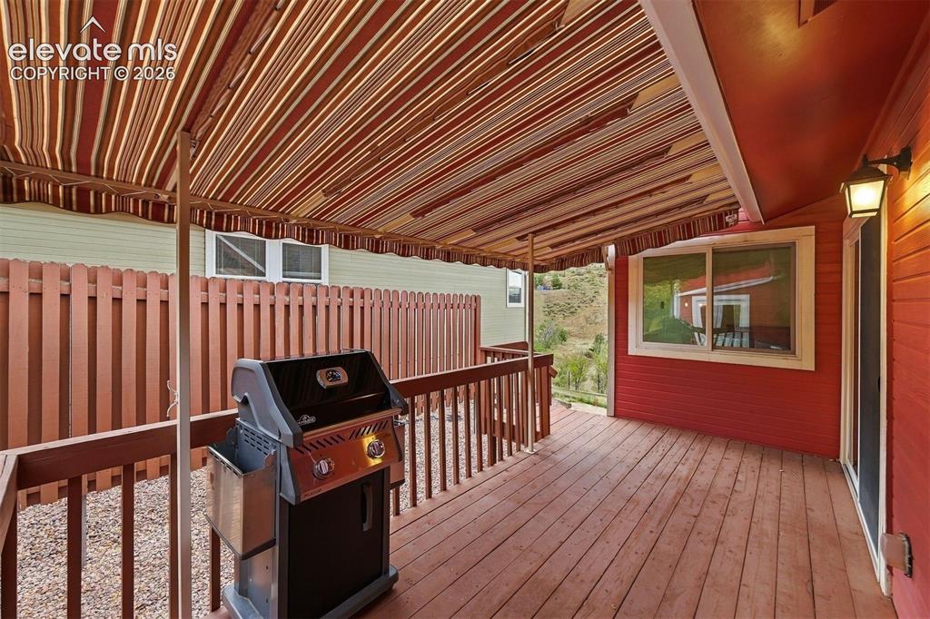 Image 6 of 40: Awning covered deck