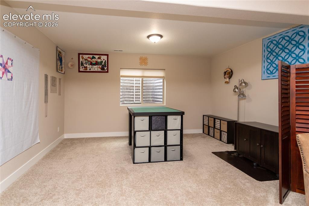Image 25 of 47: Hobby Area in Basement