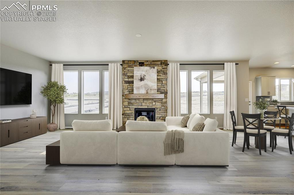 Image 11 of 39: VIRTUALLY STAGED showing another possible configuration of living room furn