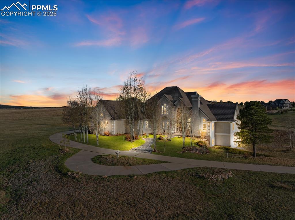 Caption: Front of home with virtual sunset 