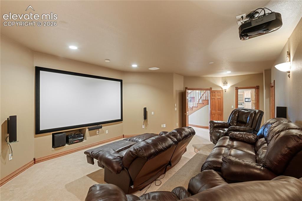 Image 40 of 50: Workout room in basement with sauna and shower