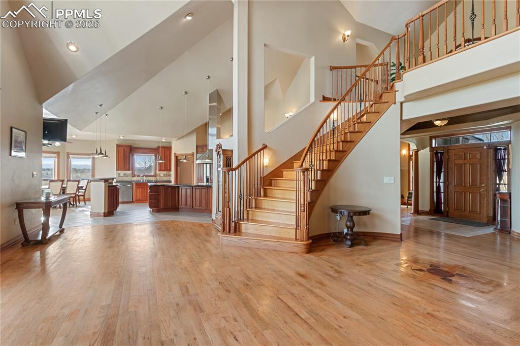Image 6 of 50: Family room looking into kitchen and entryway 