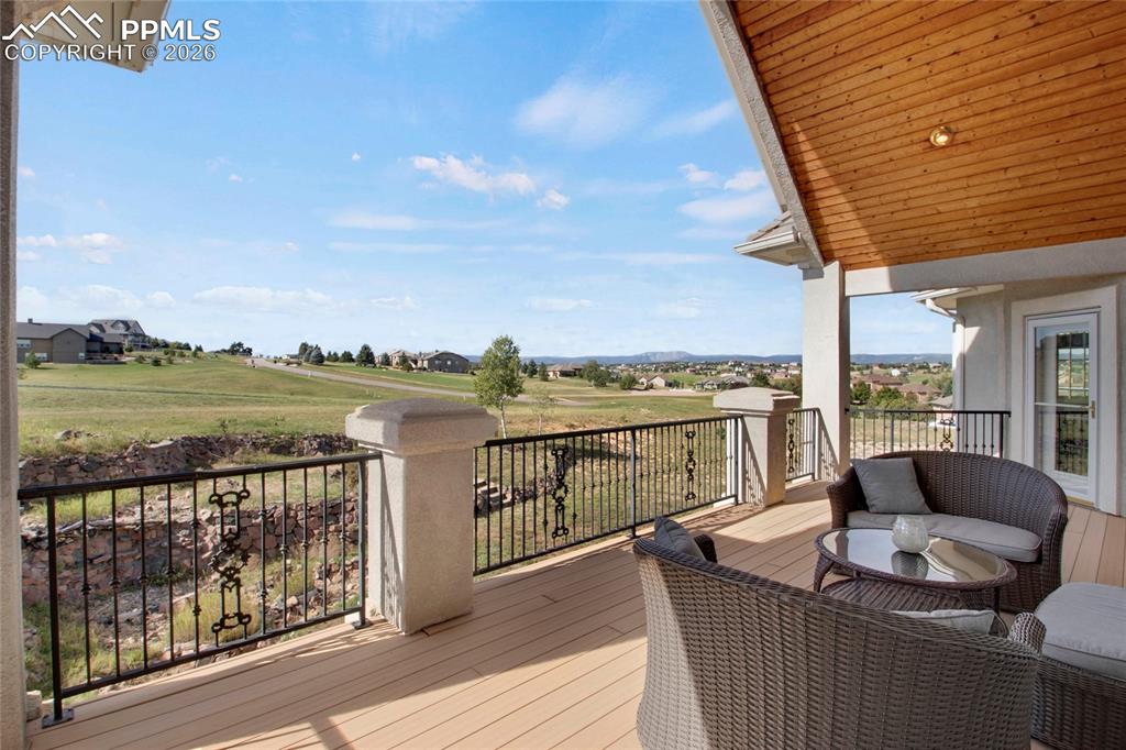 Image 7 of 50: Deck off living, kitchen and primary bedroom