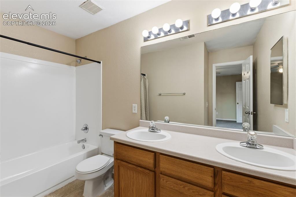 Image 19 of 27: The full Primary Bathroom with its double vanity sink!