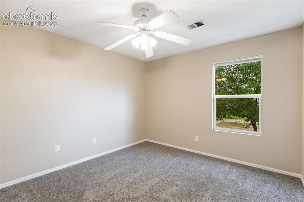 Image 20 of 27: The home has two additional rooms which can be utilized as bedrooms, office