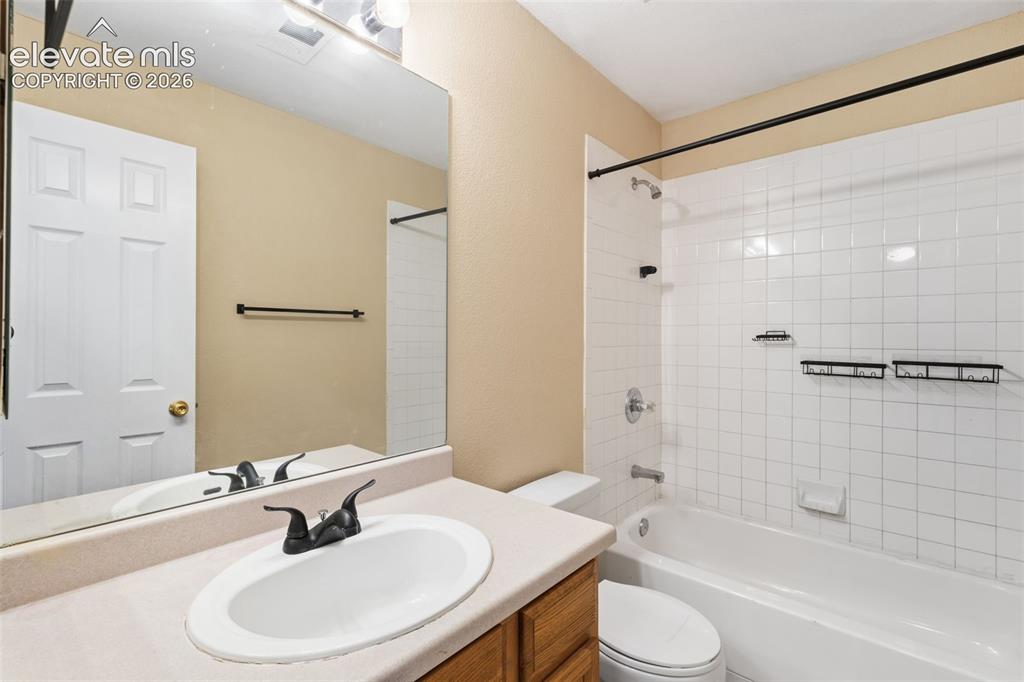 Image 24 of 27: The home has a secondary full bathroom!