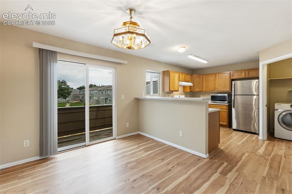 Image 9 of 27: The Dining Area is  conveniently located next to the Kitchen!