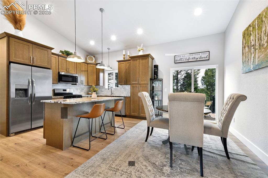 Image 7 of 40: Kitchen and Dining Area