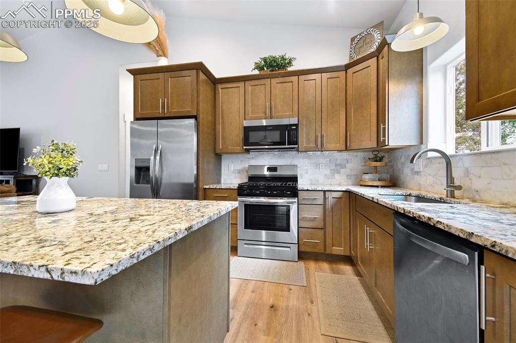Image 9 of 40: Granite Tops with Backsplash, Gas Range and Quality Cabinetry
