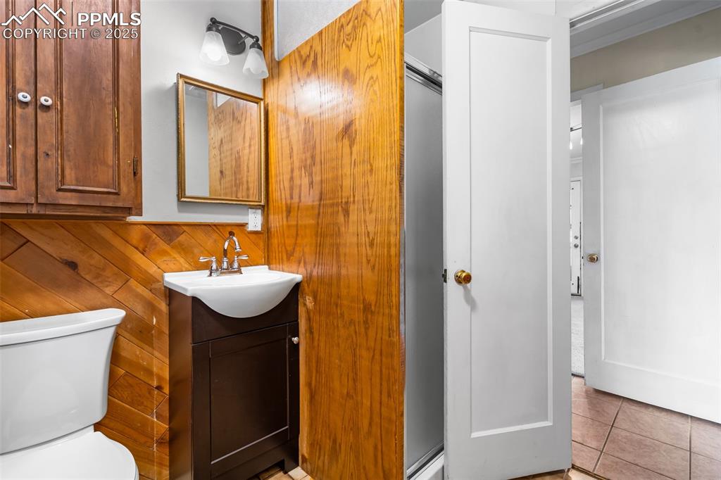 Image 20 of 41: Bathroom featuring vanity, tile patterned floors, and a shower