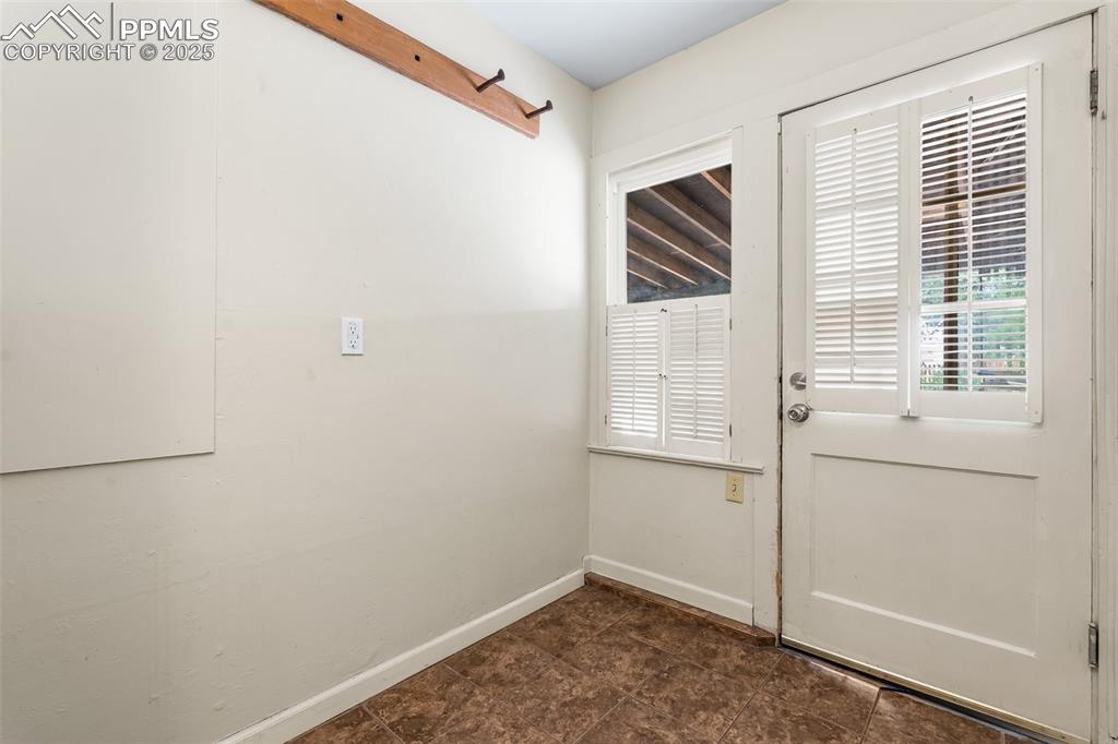 Image 22 of 41: Entryway featuring baseboards
