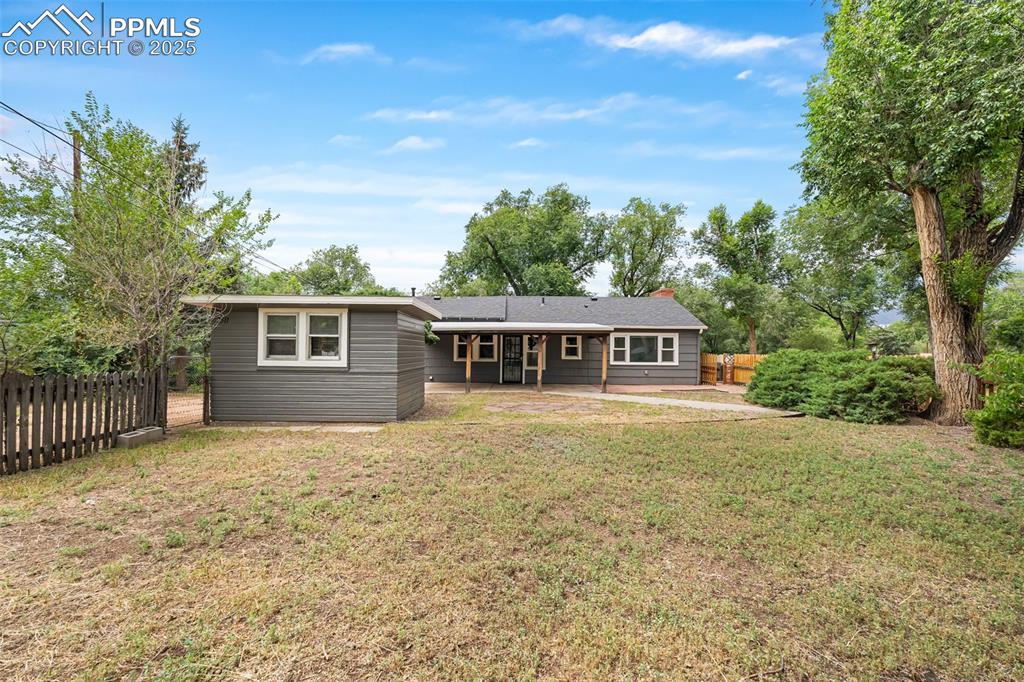Image 27 of 41: Rear view of property with a patio and a chimney