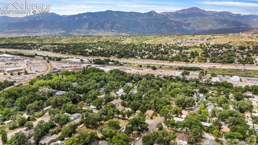 Image 36 of 41: Aerial perspective of suburban area with mountains