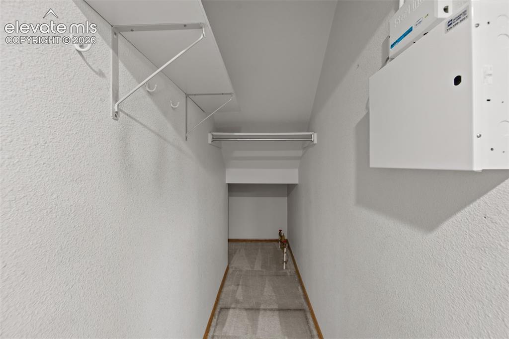 Image 13 of 35: Spacious closet under stairs