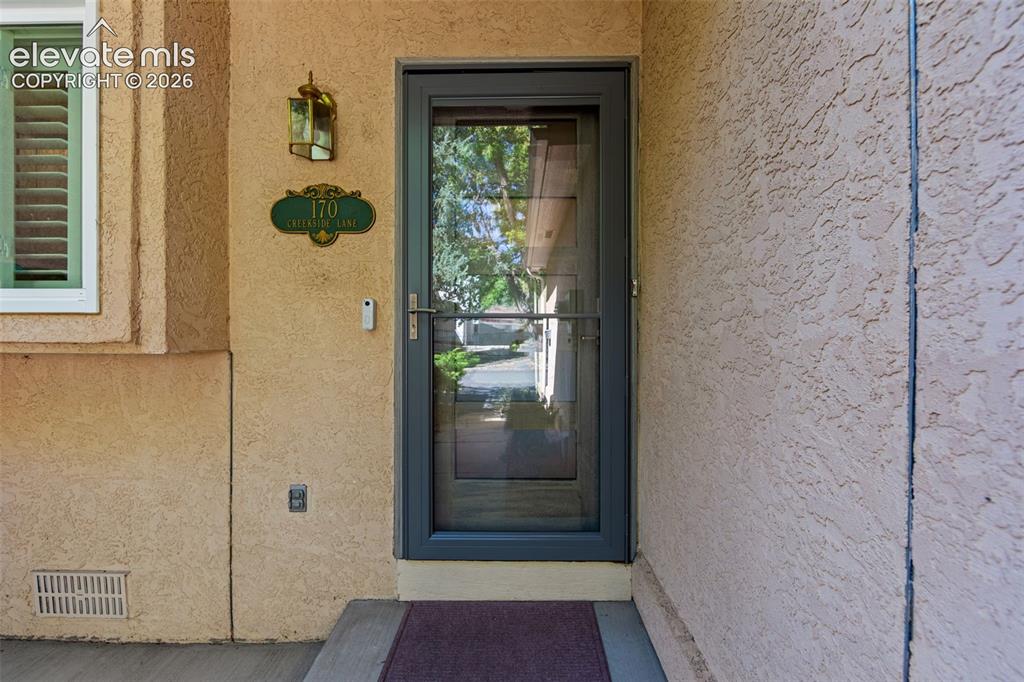 Image 31 of 35: Beautiful mid century mod door and new storm door