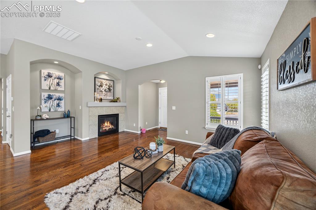 Image 12 of 40: The Front Entry has a coat closet and leads into the open vaulted Living Ro