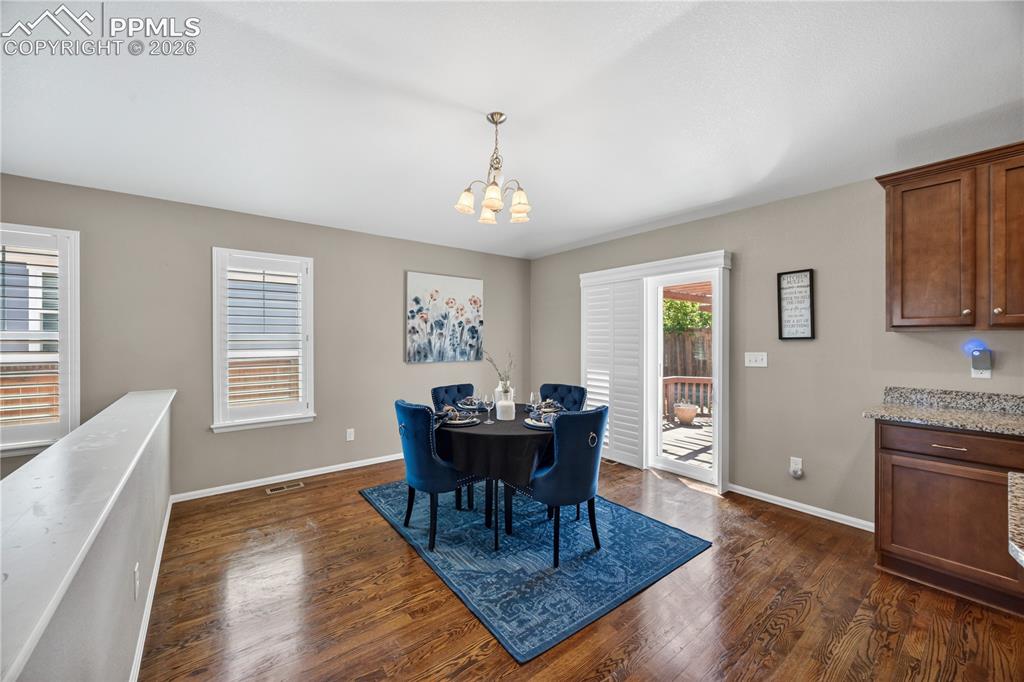 Image 3 of 40: The inviting Living Room offers gleaming hardwood floors, arched niches and