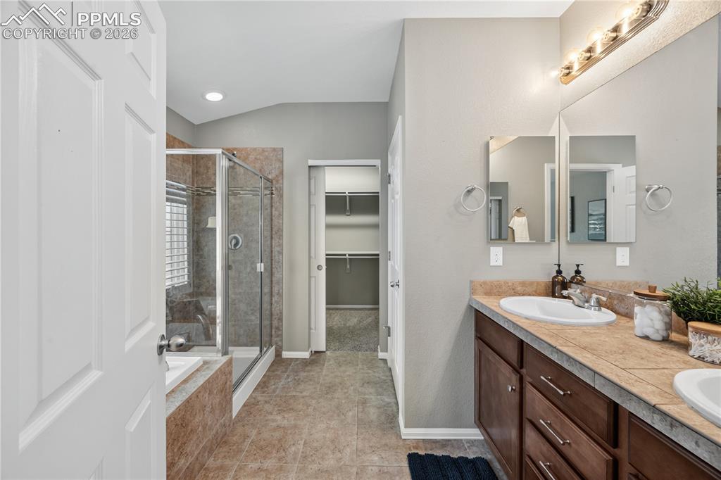 Image 6 of 40: The Island Kitchen features granite countertops, breakfast bar, pantry, amp