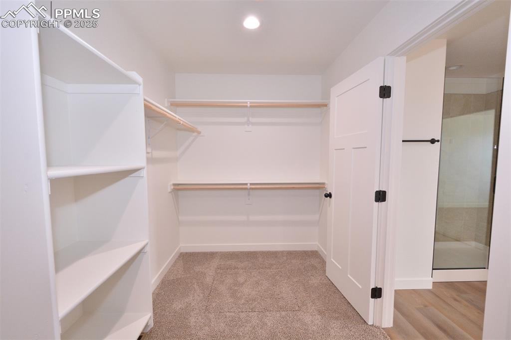 Image 17 of 24: Primary Bedroom walk in closet