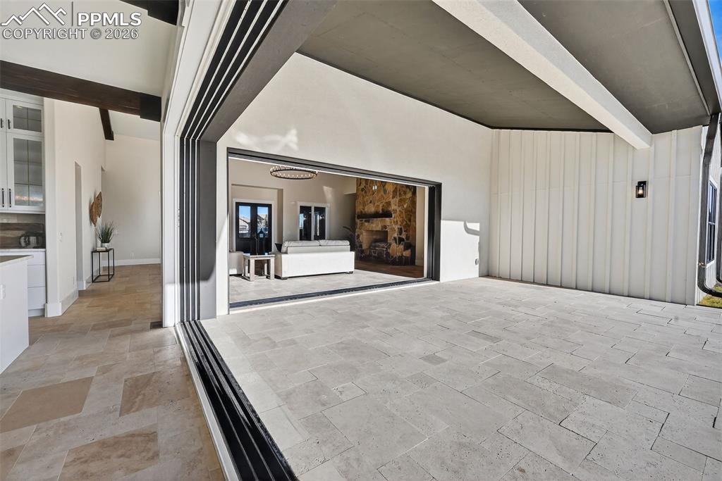 Image 48 of 49: View of patio / terrace with a garage