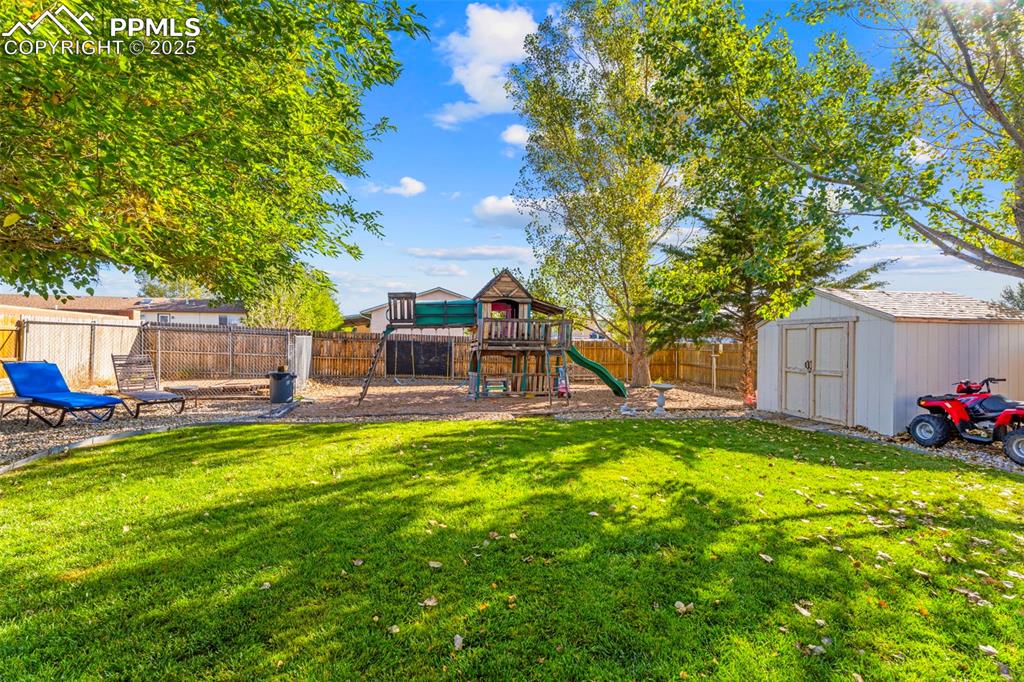 Image 8 of 29: Dog pen in the corner. Storage shed as well