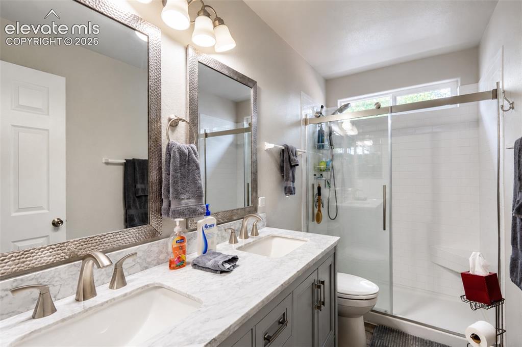 Image 20 of 27: Ensuite primary full bathroom (2) with dual sinks