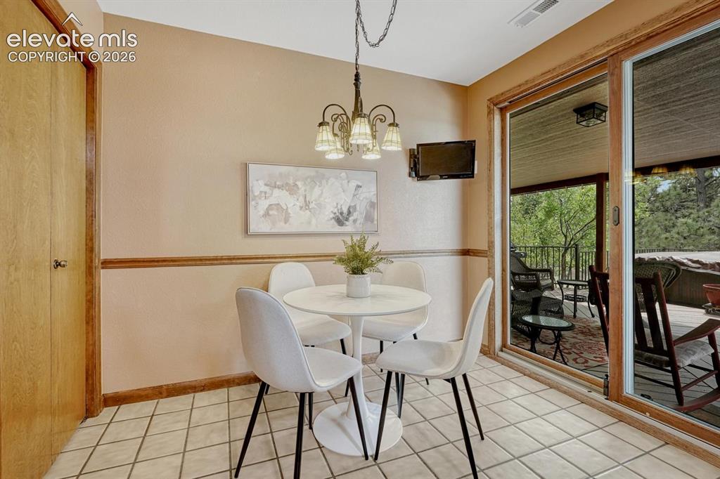 Image 17 of 50: The Dining Nook is located off the Kitchen for informal dining and opens to