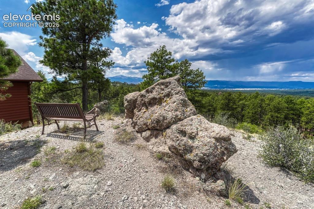 Image 2 of 50: Perched high above Colorado Springs, this exceptional custom 4BR, 3BA home