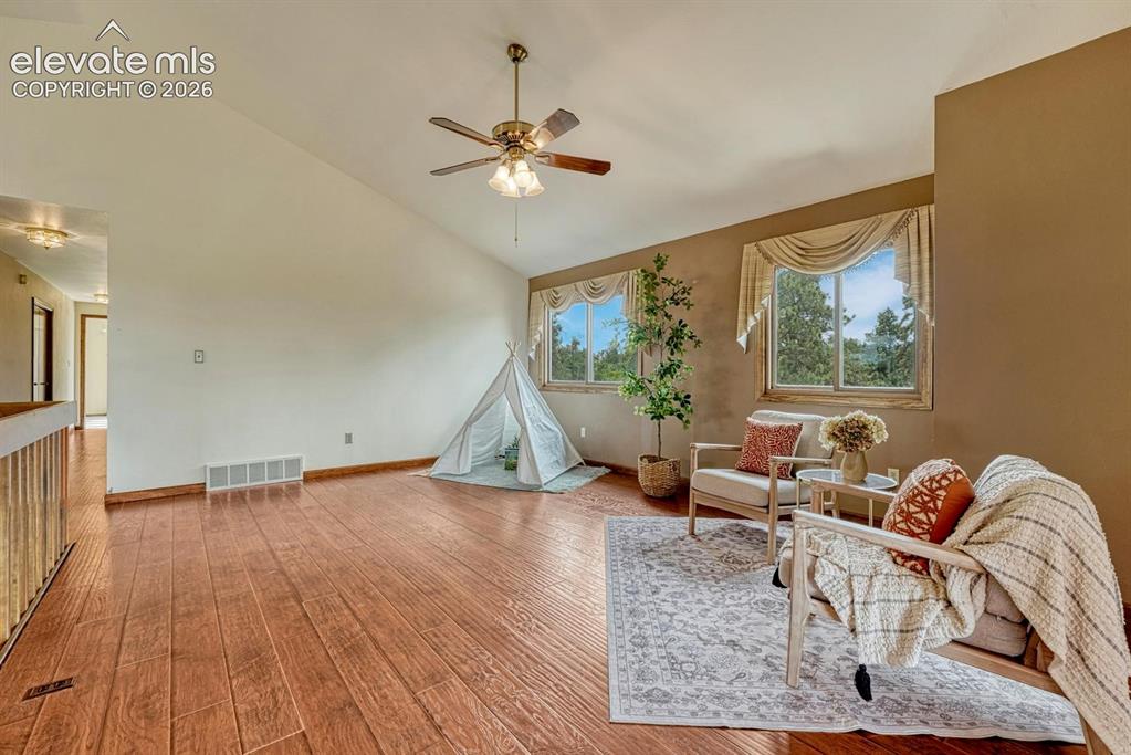Image 24 of 50: The upper level Living Room provides an additional gathering place with LVP