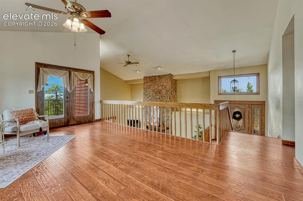Image 25 of 50: French doors lead to an outdoor deck where you can enjoy the Colorado sunsh