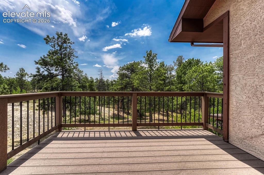 Image 33 of 50: Private deck off the Primary Bedroom to enjoy quiet time and amazing views.