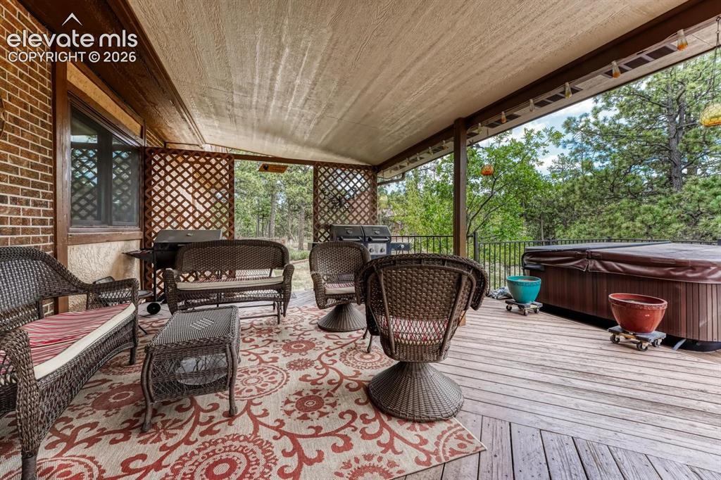 Image 39 of 50: Covered backyard deck.