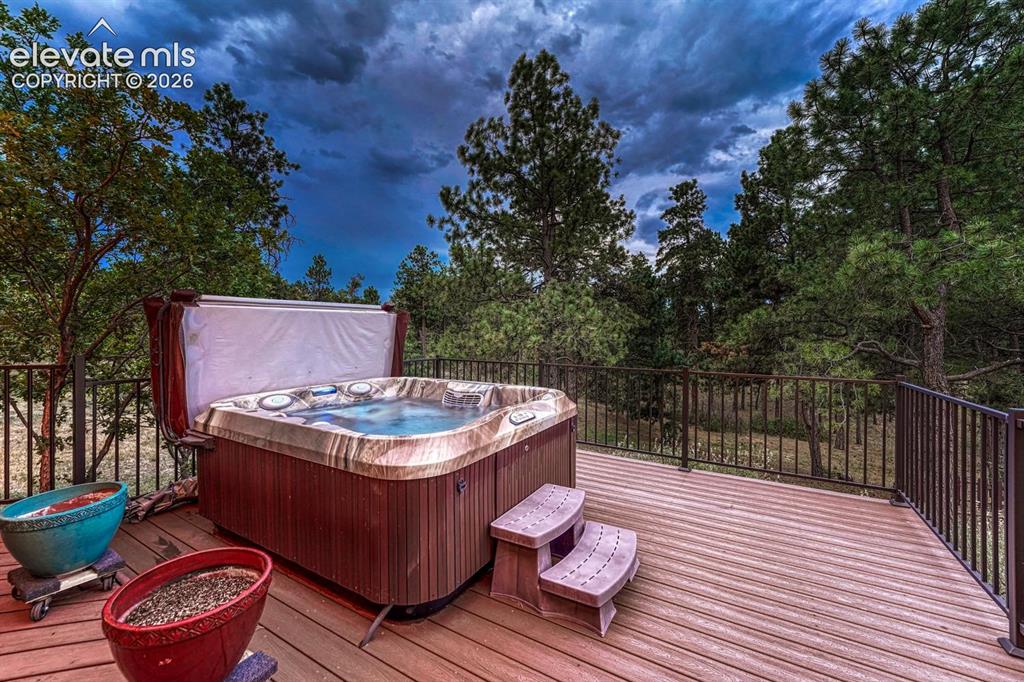 Image 40 of 50: Sunset view of hot tub to enjoy after a long day