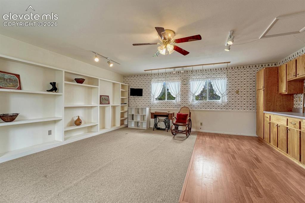 Image 48 of 50: Versatile space - currently used as a craft room with lighted ceiling fan,