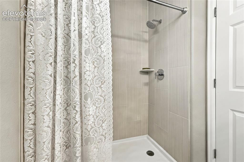 Image 16 of 25: new shower basin, hardware and floor to ceiling high quality porcelain tile
