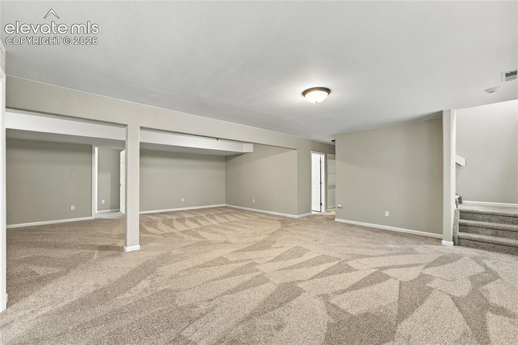 Image 18 of 24: create separate living spaces in large recreation room
