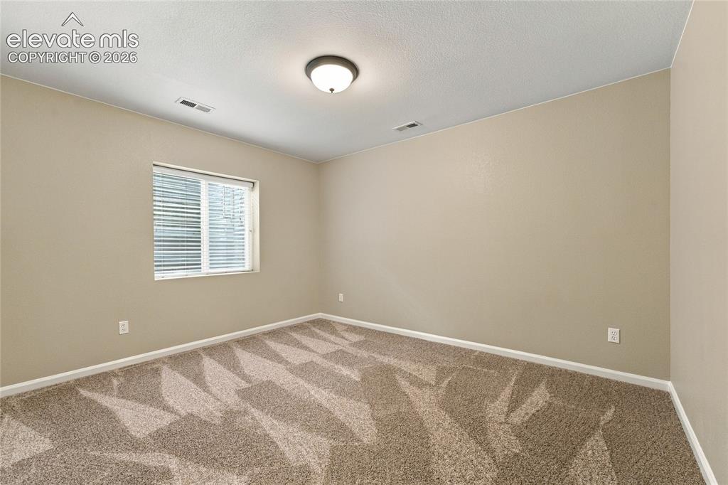 Image 20 of 24: spacious basement bedroom 