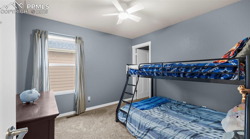Image 13 of 43: Bedroom featuring light carpet and ceiling fan