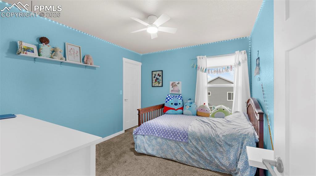 Image 14 of 43: Carpeted bedroom featuring ceiling fan and baseboards