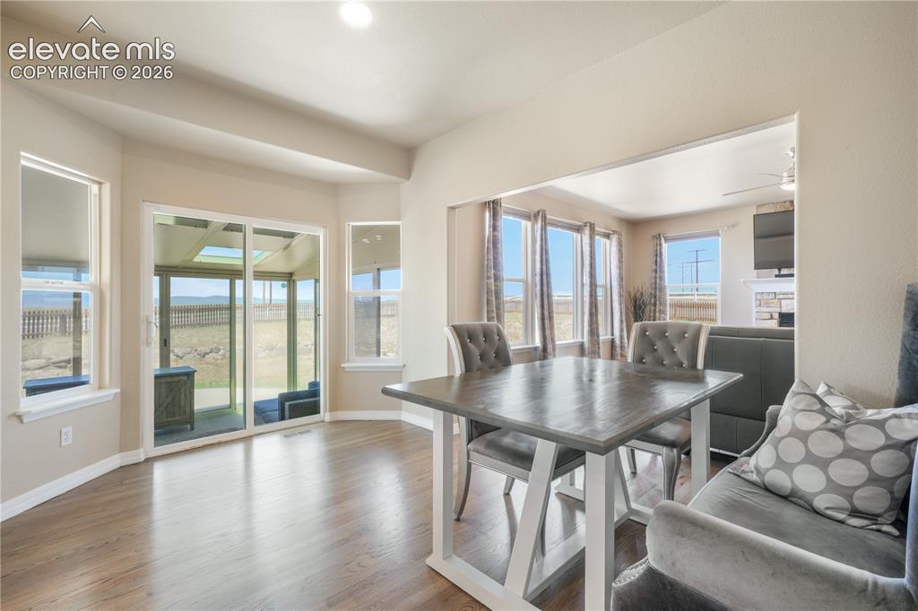 Image 12 of 50: Dining Nook with Access to Sunroom