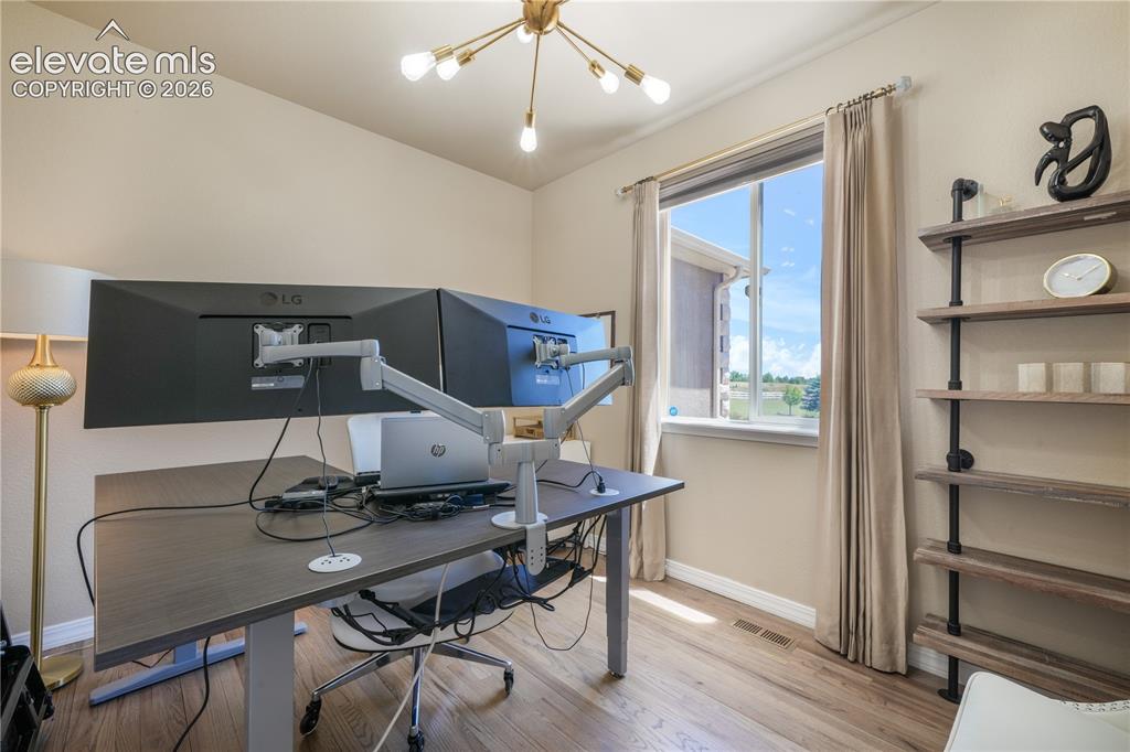 Image 19 of 50: Main Level Office with Barn Doors