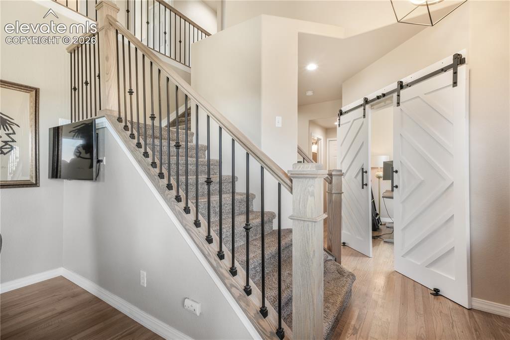 Image 20 of 50: Stairs to Upper Level and Entryway