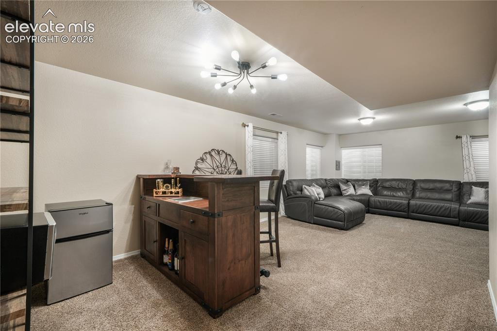 Image 34 of 50: Large Basement Family Room with Endless Possibilities