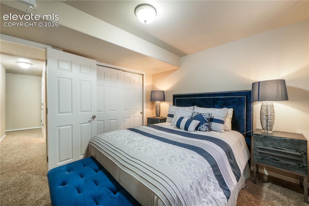 Image 41 of 50: Basement Bedroom with Barn Door connecting to Second Basement Bedroom