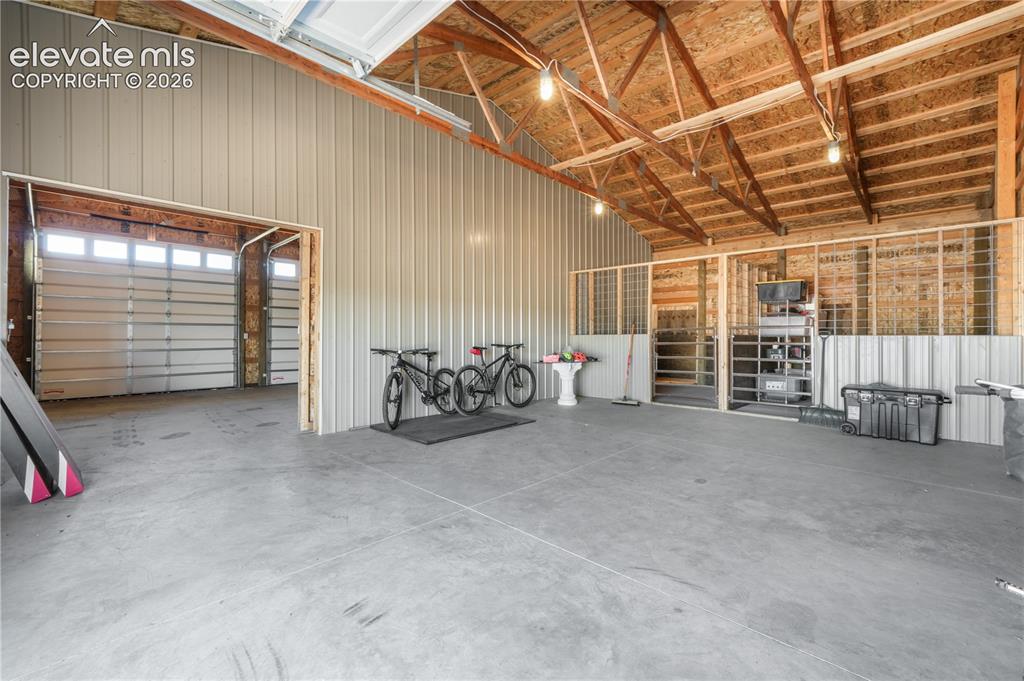 Image 44 of 50: Concrete Flooring and 3 Garage Doors