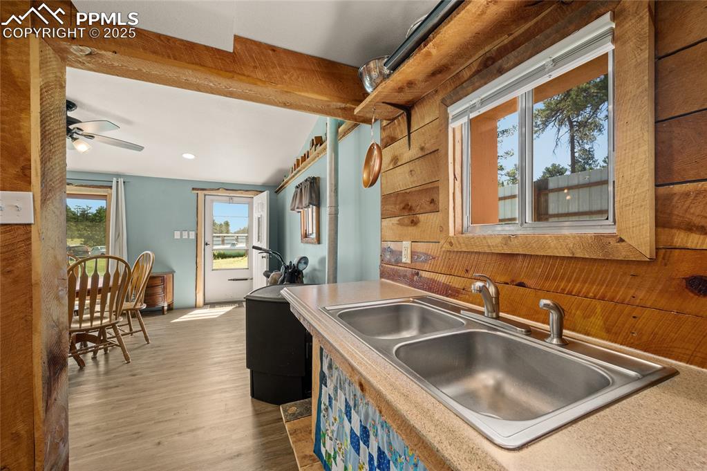 Image 10 of 27: Kitchen featuring wood finished floors, a ceiling fan, and recessed lightin