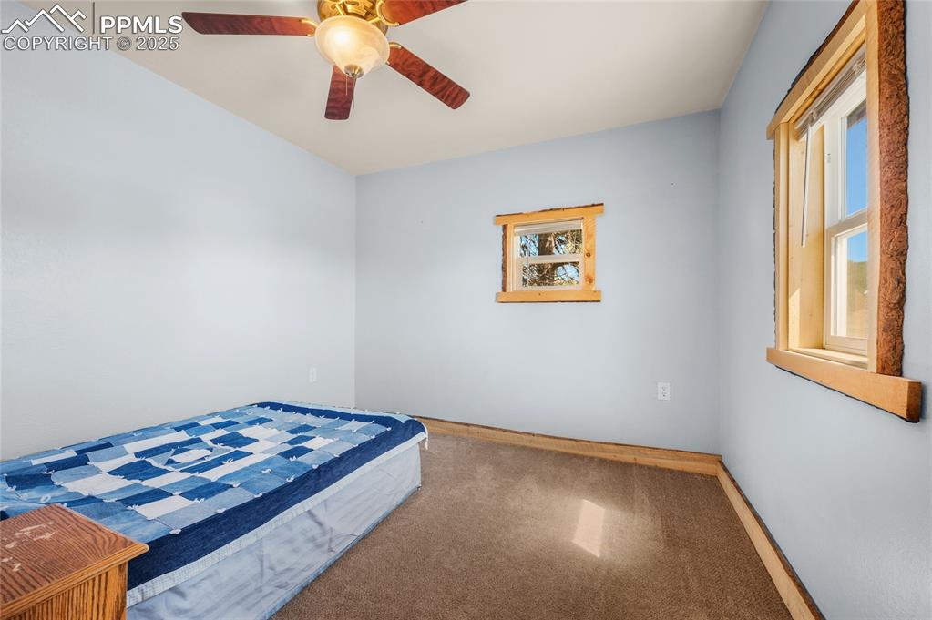 Image 11 of 27: Unfurnished bedroom with carpet and ceiling fan